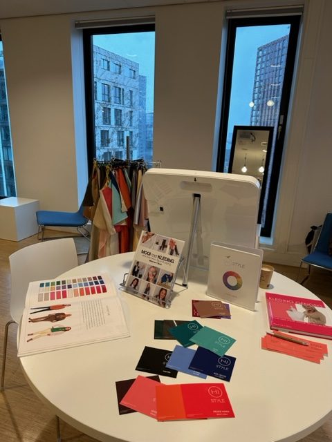 a table with a book and catalogs on it